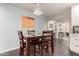 Bright dining room with a wooden table and chairs, near the kitchen at 1837 E Minnezona Ave, Phoenix, AZ 85016