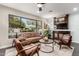 Mid-century modern living room with brown leather armchairs and a sofa at 1837 E Minnezona Ave, Phoenix, AZ 85016