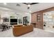 Living room with exposed brick wall, fireplace, and built-in shelving at 1837 E Minnezona Ave, Phoenix, AZ 85016