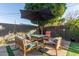 Outdoor patio with umbrella, seating, and fire pit at 1837 E Minnezona Ave, Phoenix, AZ 85016