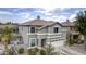 Two-story house with a brown roof, gray walls, and a two-car garage at 1908 E Hawken Pl, Chandler, AZ 85286