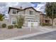 Two-story house with a front yard, driveway, and a pool at 1908 E Hawken Pl, Chandler, AZ 85286