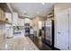 Modern kitchen with granite counters and stainless steel appliances at 1908 E Hawken Pl, Chandler, AZ 85286