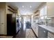 Modern kitchen with stainless steel appliances and island at 1908 E Hawken Pl, Chandler, AZ 85286