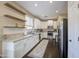 Spacious kitchen, granite countertops, and dark wood floors at 1908 E Hawken Pl, Chandler, AZ 85286