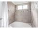 Bathroom with tub, shower, and tile surround at 2047 E Devon Rd, Gilbert, AZ 85296