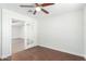 Bedroom with wood floors and access to another room at 2047 E Devon Rd, Gilbert, AZ 85296