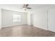 Spacious bedroom with ceiling fan and wood-look tile flooring at 2047 E Devon Rd, Gilbert, AZ 85296