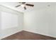 Bright bedroom with wood floors and ceiling fan at 2047 E Devon Rd, Gilbert, AZ 85296