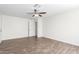 Spacious bedroom with ceiling fan and wood-look tile flooring at 2047 E Devon Rd, Gilbert, AZ 85296