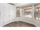 White kitchen with wood-look breakfast bar at 2047 E Devon Rd, Gilbert, AZ 85296