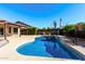 Stunning pool with tiled accents in the backyard at 2047 E Devon Rd, Gilbert, AZ 85296