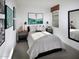 Main bedroom with a beige duvet and gray nightstands at 20775 N Roadrunner Ln, Maricopa, AZ 85138