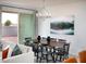 Dining room with a wooden table and six black chairs at 20775 N Roadrunner Ln, Maricopa, AZ 85138