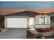 One-story home with a two-car garage and landscaped front yard at 20775 N Roadrunner Ln, Maricopa, AZ 85138