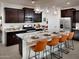 Kitchen with dark brown cabinets and granite countertops at 20775 N Roadrunner Ln, Maricopa, AZ 85138