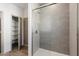 Bathroom with glass shower and patterned tile at 2125 E Voltaire Ave, Phoenix, AZ 85022