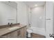 Bathroom with a shower/tub combo and white subway tile at 2125 E Voltaire Ave, Phoenix, AZ 85022