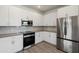 Modern kitchen, stainless steel appliances and white cabinets at 2125 E Voltaire Ave, Phoenix, AZ 85022