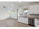 Open concept kitchen with gray counters and white cabinets at 2125 E Voltaire Ave, Phoenix, AZ 85022