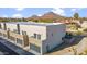 Aerial view of contemporary townhouses with private garages and mountain views at 2126 E Voltaire Ave, Phoenix, AZ 85022