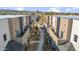 Aerial view of a complex of townhouses with a landscaped courtyard at 2126 E Voltaire Ave, Phoenix, AZ 85022