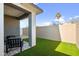 Cozy backyard patio with artificial turf at 2126 E Voltaire Ave, Phoenix, AZ 85022