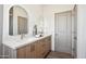 Bathroom with double vanity, quartz countertop, and arched mirrors at 2126 E Voltaire Ave, Phoenix, AZ 85022