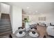 Modern dining area with a round table and chairs near the staircase at 2126 E Voltaire Ave, Phoenix, AZ 85022