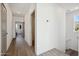 Upstairs hallway with doors to bedrooms and bathroom at 2126 E Voltaire Ave, Phoenix, AZ 85022