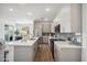 Modern kitchen with stainless steel appliances and white cabinetry at 2126 E Voltaire Ave, Phoenix, AZ 85022