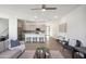 Bright and airy living room with an open floor plan and kitchen view at 2126 E Voltaire Ave, Phoenix, AZ 85022