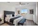 Spacious main bedroom with plush bed and modern decor at 2126 E Voltaire Ave, Phoenix, AZ 85022