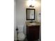 Bathroom with granite vanity and dark brown cabinets at 2208 W Lindner Ave # 17, Mesa, AZ 85202