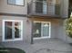 View of back exterior, sliding glass doors, and patio at 2208 W Lindner Ave # 17, Mesa, AZ 85202