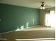 Spacious living room with neutral carpeting and teal accent wall at 2208 W Lindner Ave # 17, Mesa, AZ 85202