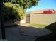 Backyard patio with brick pavers and citrus tree at 2208 W Lindner Ave # 17, Mesa, AZ 85202