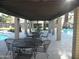 Covered patio area with tables and chairs near the pool at 2208 W Lindner Ave # 17, Mesa, AZ 85202