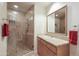 Bathroom with walk in shower and updated vanity at 2211 E Camelback Rd # 201, Phoenix, AZ 85016