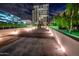 Night view of modern building, with well-lit walkway at 2211 E Camelback Rd # 201, Phoenix, AZ 85016