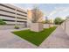 Landscaped courtyard with artificial turf and modern planters at 2211 E Camelback Rd # 201, Phoenix, AZ 85016