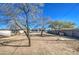 House backyard with trees and desert landscaping at 232 S San Carlos St, Florence, AZ 85132