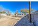 Backyard view showing a house and chain link fence at 232 S San Carlos St, Florence, AZ 85132