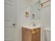 Bathroom features a vanity with wood cabinet at 232 S San Carlos St, Florence, AZ 85132