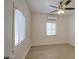 Bright bedroom with ceiling fan and wood floors at 232 S San Carlos St, Florence, AZ 85132