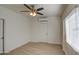 Bright bedroom with wood floors,ceiling fan and window blinds at 232 S San Carlos St, Florence, AZ 85132