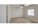 Light and airy bedroom with wood floors and a ceiling fan at 232 S San Carlos St, Florence, AZ 85132