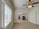 Open living room with wood floors and views into the kitchen and bathroom at 232 S San Carlos St, Florence, AZ 85132