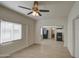 Living room with wood floors, ceiling fan and view of kitchen at 232 S San Carlos St, Florence, AZ 85132