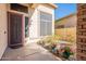 Charming front entryway features decorative pots, stonework, and a secure screen door at 2418 E Glass Ln, Phoenix, AZ 85042